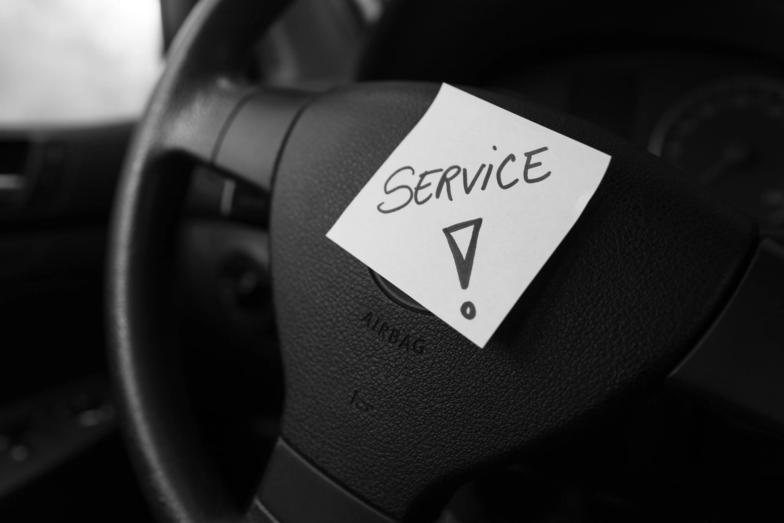 140234925_l Writing service on memo post reminder. Text on sticky paper inside car dashboard.